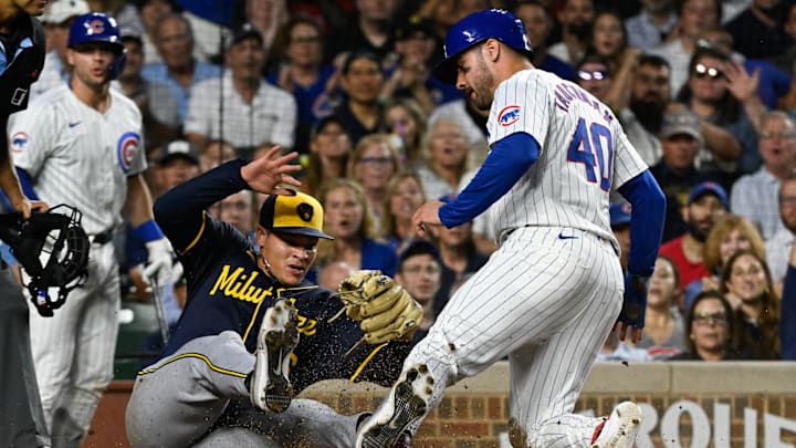 Chicago Cubs outfielder Mike Tauchman (40) scores past Milwaukee Brewers pitcher Tobias Myers (36) on a wild pitch during the fourth inning at Wrigley Field on July 22. Chicago Cubs outfielder Mike Tauchman (40) scores past Milwaukee Brewers pitcher Tobias Myers (36) on a wild pitch during the fourth inning at Wrigley Field on July 22.