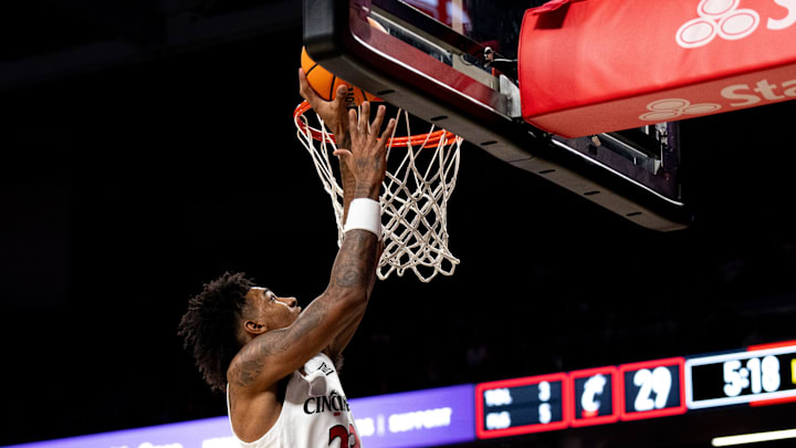 Cincinnati Bearcats forward Dillon Mitchell (23) hits a jump shot in the first half of a basketball scrimmage between Cincinnati Bearcats and Ohio State Buckeyes at Fifth Third Arena in Cincinnati on Friday, Oct. 18, 2024. Cincinnati Bearcats forward Dillon Mitchell (23) hits a jump shot in the first half of a basketball scrimmage between Cincinnati Bearcats and Ohio State Buckeyes at Fifth Third Arena in Cincinnati on Friday, Oct. 18, 2024.