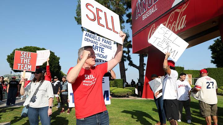 Angels fans gather outside Angel Stadium before the game between the Los Angeles Angels and the Texas Rangers to protest the Angels team owner Arte Moreno on May 23, 2026.