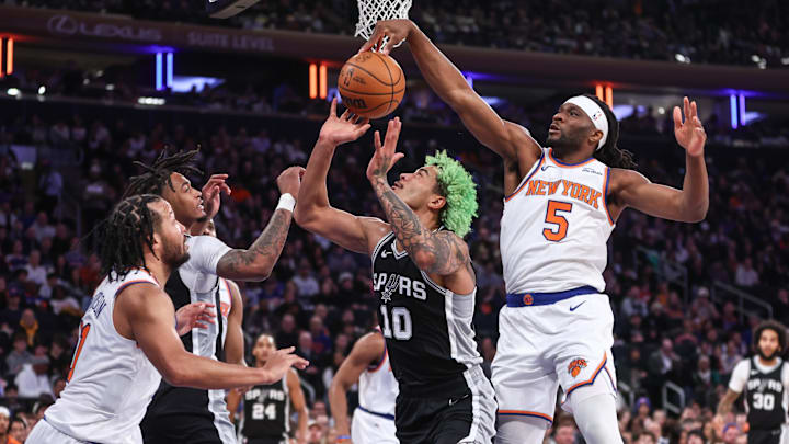 Dec 25, 2024; New York, New York, USA; New York Knicks forward Precious Achiuwa (5) blocks a shot taken by San Antonio Spurs forward Jeremy Sochan (10) in the first quarter at Madison Square Garden.