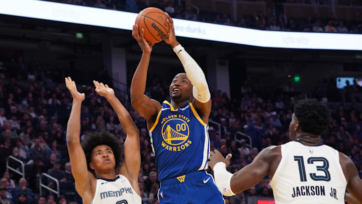 Jan 4, 2025; San Francisco, California, USA; Golden State Warriors forward Jonathan Kuminga (00) shoots a jumpshot against Memphis Grizzlies forward Jaylen Wells (0) and forward/center Jaren Jackson Jr. (13) in the second quarter at Chase Center. Mandatory Credit: David Gonzales-Imagn Images Jan 4, 2025; San Francisco, California, USA; Golden State Warriors forward Jonathan Kuminga (00) shoots a jumpshot against Memphis Grizzlies forward Jaylen Wells (0) and forward/center Jaren Jackson Jr. (13) in the second quarter at Chase Center. Mandatory Credit: David Gonzales-Imagn Images