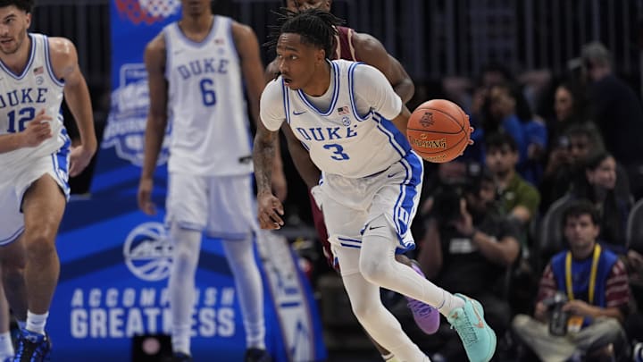 Mar 12, 2026; Charlotte, NC, USA; Duke Blue Devils guard Isaiah Evans (3) brings the ball up court on a steal against the Florida State Seminoles during the first half at Spectrum Center.