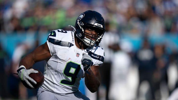 Seattle running back Kenneth Walker III (9) runs against Tennessee during their game at Nissan Stadium Sunday, Nov. 23, 2025.