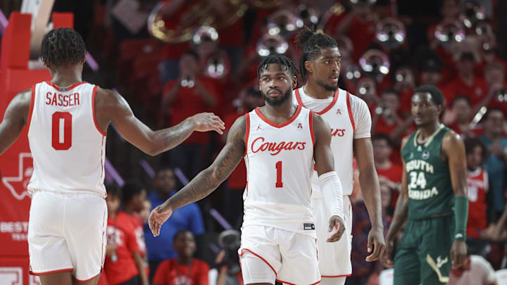 Jan 11, 2023; Houston, Texas, USA; /Houston Cougars guard Jamal Shead (1) celebrates with guard Marcus Sasser (0) after the game against the South Florida Bulls at Fertitta Center. Mandatory Credit: Troy Taormina-Imagn Images