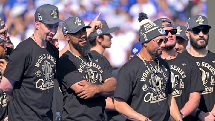 Nov 3, 2025; Los Angeles, CA, USA; Los Angeles Dodgers pitcher Blake Snell (7), right fielder Teoscar Hernandez (37), shortstop Mookie Betts (50) and second baseman Miguel Rojas (72)
on stage during the World Series celebration at Dodger Stadium. Mandatory Credit: Jayne Kamin-Oncea-Imagn Images