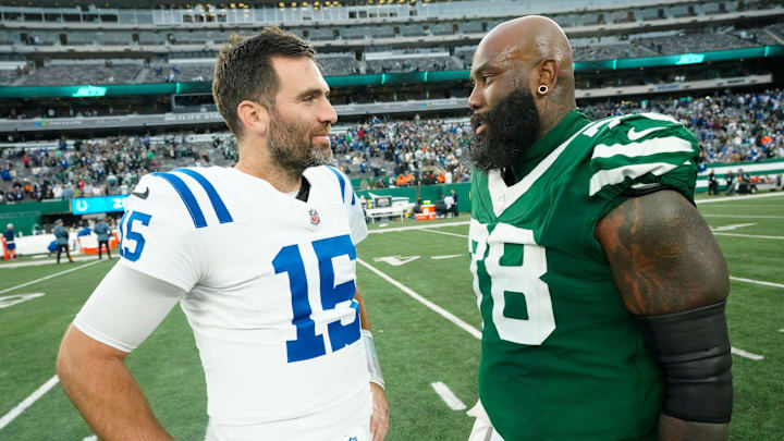 Indianapolis Colts quarterback Joe Flacco (15) and New York Jets offensive tackle Morgan Moses (78) are shown after the game, Sunday, November 17, 2024, in East Rutherford.