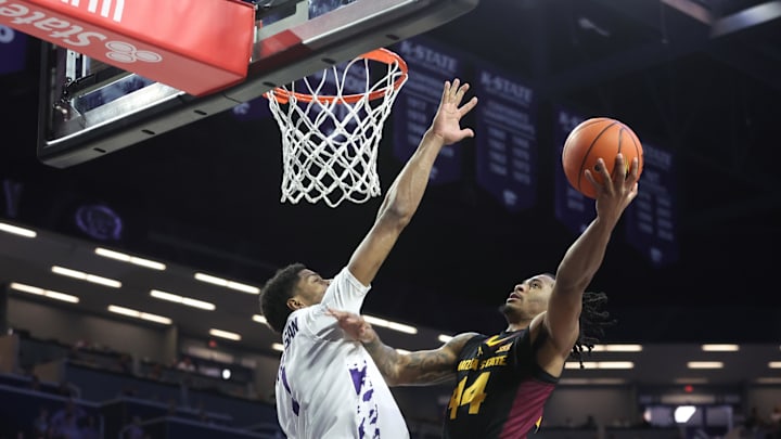 Feb 23, 2025; Manhattan, Kansas, USA; Arizona State Sun Devils guard Adam Miller (44) shoots against Kansas State Wildcats forward David N'Guessan (1) during the first half  at Bramlage Coliseum. Mandatory Credit: Scott Sewell-Imagn Images