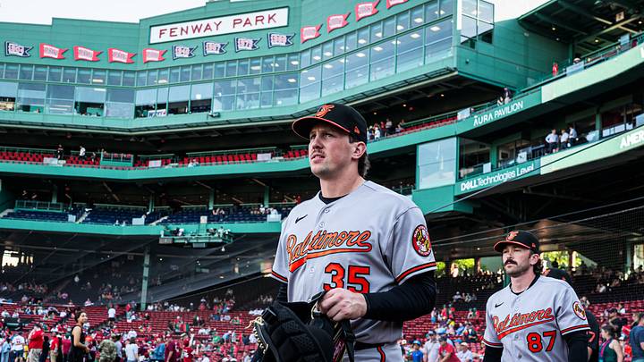 Jun 3, 2026; Boston, Massachusetts, USA; Baltimore Orioles catcher Adley Rutschman (35) and field coordinator/catching coach Joe Singley (87) walk to the bullpen before the start of the game against the Boston Red Sox at Fenway Park. Mandatory Credit: David Butler II-Imagn Images Jun 3, 2026; Boston, Massachusetts, USA; Baltimore Orioles catcher Adley Rutschman (35) and field coordinator/catching coach Joe Singley (87) walk to the bullpen before the start of the game against the Boston Red Sox at Fenway Park. Mandatory Credit: David Butler II-Imagn Images