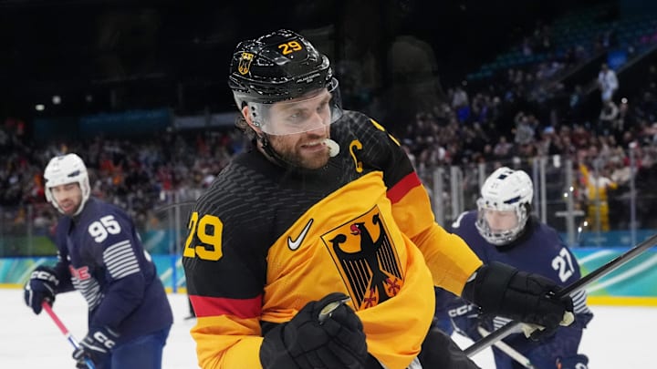 Feb 17, 2026; Milan, Italy; Leon Draisaitl of Germany celebrates after scoring their first goal during a men's ice hockey qualification playoff game during the Milano Cortina 2026 Olympic Winter Games at Milano Santagiulia Ice Hockey Arena. Mandatory Credit: Amber Searls-Imagn Images
