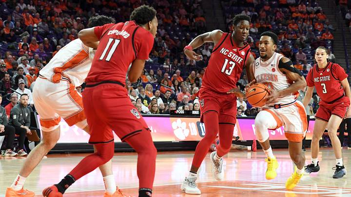 Clemson Tigers guard Ace Buckner (21) is defended by NC State Wolfpack forward Musa Sagnia (13) Tuesday, Jan. 20, 2026, during the NCAA men’s basketball game at Littlejohn Coliseum in Clemson, South Carolina.