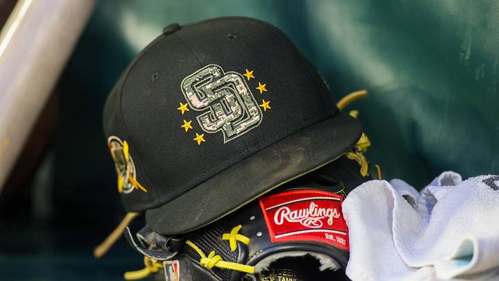 May 17, 2024; Atlanta, Georgia, USA; A detailed view of a San Diego Padres hat and glove on the bench against the Atlanta Braves in the third inning at Truist Park. Mandatory Credit: Brett Davis-Imagn Images May 17, 2024; Atlanta, Georgia, USA; A detailed view of a San Diego Padres hat and glove on the bench against the Atlanta Braves in the third inning at Truist Park. Mandatory Credit: Brett Davis-Imagn Images