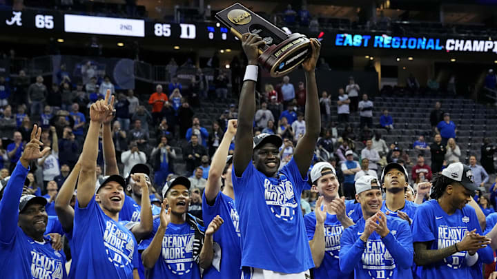 Duke Blue Devils center Khaman Maluach (9) raise the East Region trophy after beating the Alabama Crimson Tide.