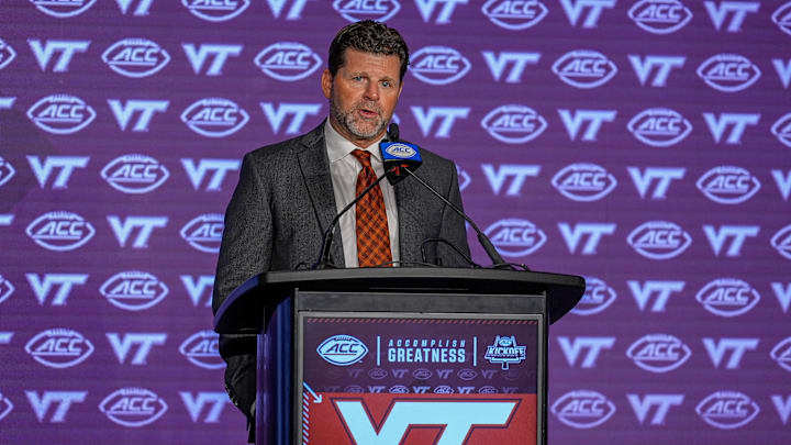 Jul 23, 2024; Charlotte, NC, USA; Virginia Tech head coach Brent Pry answers questions from the media during the ACC Kickoff at Hilton Charlotte Uptown. Mandatory Credit: Jim Dedmon-Imagn Images