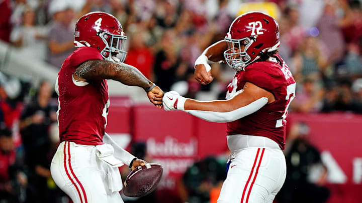 Sep 28, 2024; Tuscaloosa, Alabama, USA; Alabama Crimson Tide quarterback Jalen Milroe (4) celebrates with offensive lineman Parker Brailsford (72) after scoring a touchdown during the first quarter against the Georgia Bulldogs at Bryant-Denny Stadium. Mandatory Credit: John David Mercer-Imagn Images