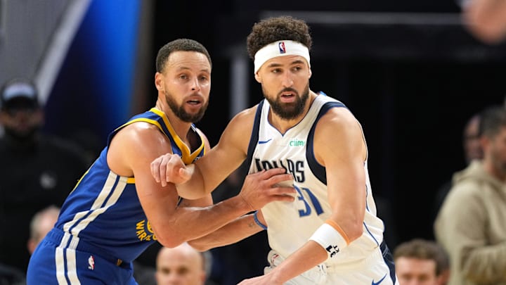 Dec 15, 2024; San Francisco, California, USA; Golden State Warriors guard Stephen Curry (left) defends against Dallas Mavericks guard Klay Thompson (31) during the fourth quarter at Chase Center. Mandatory Credit: Darren Yamashita-Imagn Images