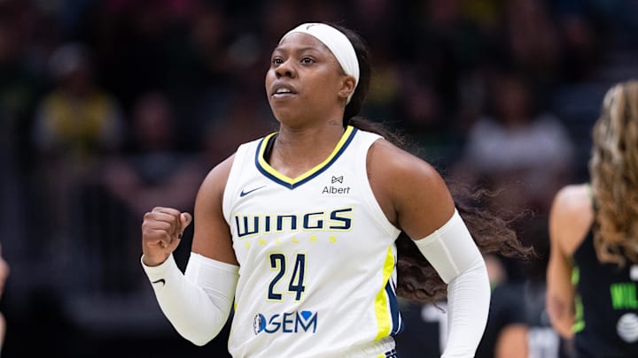 Jul 22, 2025; Seattle, Washington, USA;  Dallas Wings guard Arike Ogunbowale (24) pumps her fist during the first half against the Seattle Storm at Climate Pledge Arena. Mandatory Credit: Stephen Brashear-Imagn Images