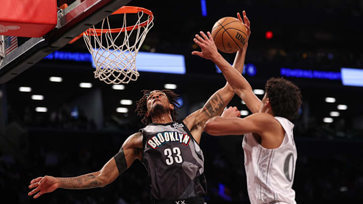 Mar 24, 2025; Brooklyn, New York, USA; Brooklyn Nets center Nic Claxton (33) goes to the basket as Dallas Mavericks guard Max Christie (00) defends during the first half at Barclays Center. Mandatory Credit: Vincent Carchietta-Imagn Images Mar 24, 2025; Brooklyn, New York, USA; Brooklyn Nets center Nic Claxton (33) goes to the basket as Dallas Mavericks guard Max Christie (00) defends during the first half at Barclays Center. Mandatory Credit: Vincent Carchietta-Imagn Images