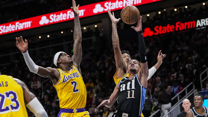 Jan 30, 2024; Atlanta, Georgia, USA; Atlanta Hawks guard Trae Young (11) shoots at the basket over Jan 30, 2024; Atlanta, Georgia, USA; Atlanta Hawks guard Trae Young (11) shoots at the basket over