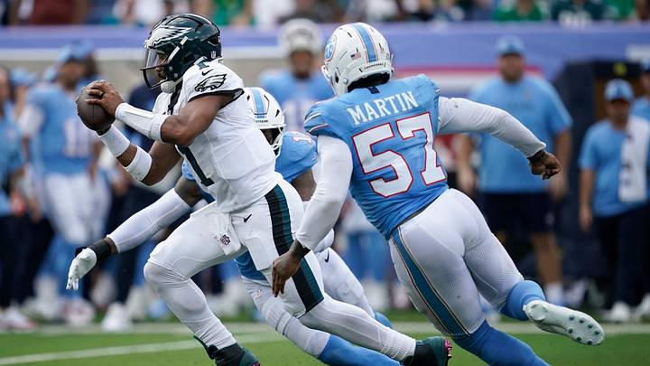 Tennessee Titans defensive end Jermaine Johnson II (11) and defensive end Jacob Martin (57) pressure Philadelphia Eagles quarterback Jalen Hurts (1) during the third quarter Sept. 20 at Nissan Stadium in Nashville, Tenn. Tennessee Titans defensive end Jermaine Johnson II (11) and defensive end Jacob Martin (57) pressure Philadelphia Eagles quarterback Jalen Hurts (1) during the third quarter Sept. 20 at Nissan Stadium in Nashville, Tenn.