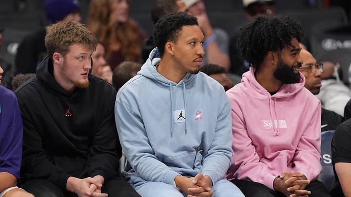 Charlotte Hornets guard Kon Knueppel (7), forward Grant Williams (2) and guard Coby White (3) on the bench Charlotte Hornets guard Kon Knueppel (7), forward Grant Williams (2) and guard Coby White (3) on the bench