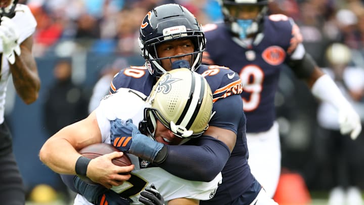 Oct 19, 2025; Chicago, Illinois, USA; Chicago Bears defensive end Dominique Robinson (90) makes a tackle for a loss on New Orleans Saints tight end Taysom Hill (7) during the second quarter at Soldier Field. Oct 19, 2025; Chicago, Illinois, USA; Chicago Bears defensive end Dominique Robinson (90) makes a tackle for a loss on New Orleans Saints tight end Taysom Hill (7) during the second quarter at Soldier Field.