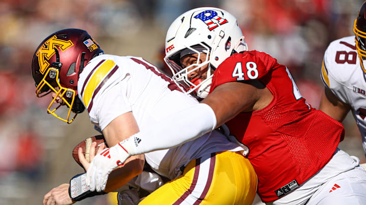 Nov 9, 2024; Piscataway, New Jersey, USA; Rutgers Scarlet Knights defensive lineman Kyonte Hamilton (48) sacks Minnesota Golden Gophers quarterback Max Brosmer (16) during the first half at SHI Stadium. Mandatory Credit: Vincent Carchietta-Imagn Images Nov 9, 2024; Piscataway, New Jersey, USA; Rutgers Scarlet Knights defensive lineman Kyonte Hamilton (48) sacks Minnesota Golden Gophers quarterback Max Brosmer (16) during the first half at SHI Stadium. Mandatory Credit: Vincent Carchietta-Imagn Images