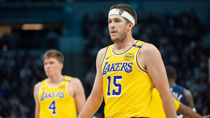 Dec 13, 2024; Minneapolis, Minnesota, USA; Los Angeles Lakers guard Austin Reaves (15) and teammates head to the bench for the break after the first quarter against the Minnesota Timberwolves at Target Center. Mandatory Credit: Matt Blewett-Imagn Images