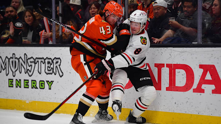 Mar 1, 2025; Anaheim, California, USA; Anaheim Ducks defenseman Drew Helleson (43) hits Chicago Blackhawks center Ryan Donato (8) while playing for the puck during the first period at Honda Center. Mandatory Credit: Gary A. Vasquez-Imagn Images Mar 1, 2025; Anaheim, California, USA; Anaheim Ducks defenseman Drew Helleson (43) hits Chicago Blackhawks center Ryan Donato (8) while playing for the puck during the first period at Honda Center. Mandatory Credit: Gary A. Vasquez-Imagn Images