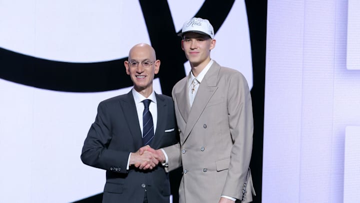 Jun 25, 2025; Brooklyn, NY, USA;  Egor Demin stands with NBA commissioner Adam Silver after being selected as the eighth pick by the Brooklyn Nets in the first round of the 2025 NBA Draft at Barclays Center. Mandatory Credit: Brad Penner-Imagn Images