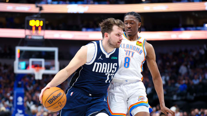 Feb 10, 2024; Dallas, Texas, USA; Dallas Mavericks guard Luka Doncic (77) drives to the basket as Jalen Williams (8) defends