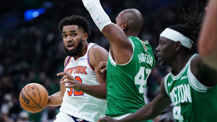 Oct 22, 2024; Boston, Massachusetts, USA; New York Knicks center Karl-Anthony Towns (32) drives the ball against Boston Celtics center Al Horford (42) in the second half at TD Garden. Mandatory Credit: David Butler II-Imagn Images