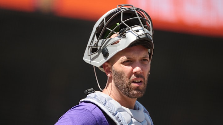 May 4, 2025; San Francisco, California, USA; Colorado Rockies catcher Jacob Stallings (25) looks on against the San Francisco Giants during the sixth inning at Oracle Park.
