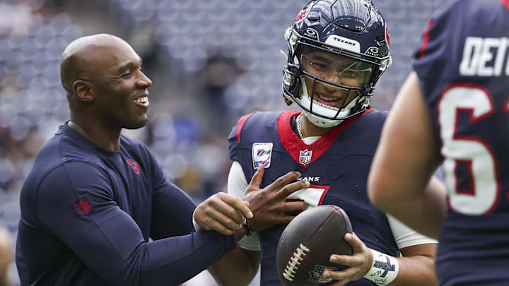 Oct 15, 2023; Houston, Texas, USA; Houston Texans head coach DeMeco Ryans laughs with quarterback C.J. Stroud (7) before the game against the New Orleans Saints at NRG Stadium. Mandatory Credit: Troy Taormina-Imagn Images