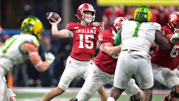 Indiana quarterback Fernando Mendoza looks to throw a pass against Oregon in the College Football Playoff semifinal game at the Peach Bowl. Indiana quarterback Fernando Mendoza looks to throw a pass against Oregon in the College Football Playoff semifinal game at the Peach Bowl.