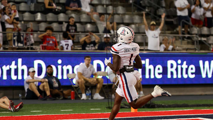 Aug 31, 2024; Tucson, Arizona, USA; Arizona Wildcats running back Jacory Croskey-Merritt (1) scores a touchdown during fourth quarter at Arizona Stadium. Mandatory Credit: Aryanna Frank-Imagn Images