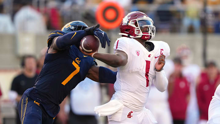 Cal's David Reese (7) strips the ball from Washington State quarterback Cam Ward (1) last year
