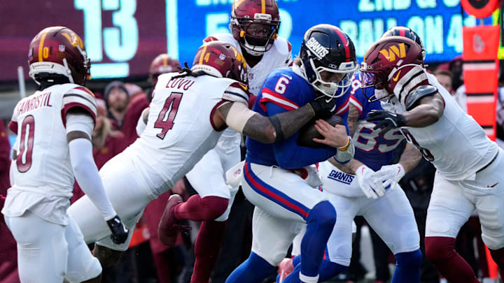 The Washington Commanders defense tries to take down New York Giants quarterback Jaxson Dart (6) in the second quarter, Sunday, December 14, 2025. Dart's run set up Big Blue for their only touchdown in the first half. The Washington Commanders defense tries to take down New York Giants quarterback Jaxson Dart (6) in the second quarter, Sunday, December 14, 2025. Dart's run set up Big Blue for their only touchdown in the first half.