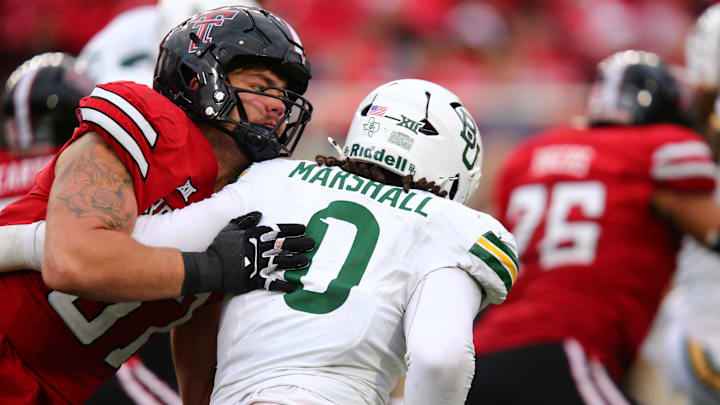 Oct 19, 2024; Lubbock, Texas, USA;  Texas Tech Red Raiders offensive lineman Davion Carter (56) blocks Baylor Bears defensive lineman Jackie Marshall (0) in the second half at Jones AT&T Stadium and Cody Campbell Field. Mandatory Credit: Michael C. Johnson-Imagn Images