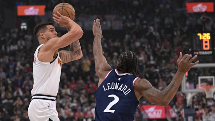 Apr 26, 2025; Inglewood, California, USA; Denver Nuggets forward Michael Porter Jr. (1) is defended by Los Angeles Clippers forward Kawhi Leonard (2) in the first half of game four of round one of the 2024 NBA Playoffs at Intuit Dome. Mandatory Credit: Jayne Kamin-Oncea-Imagn Images