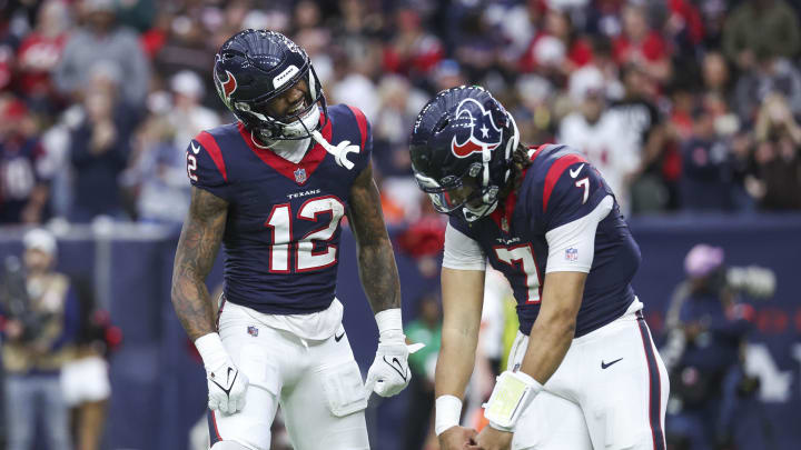 Jan 13, 2024; Houston, Texas, USA; Houston Texans wide receiver Nico Collins (12) celebrates with quarterback C.J. Stroud (7) after a touchdown in a 2024 AFC wild card game against the Cleveland Browns at NRG Stadium. Mandatory Credit: Troy Taormina-USA TODAY Sports