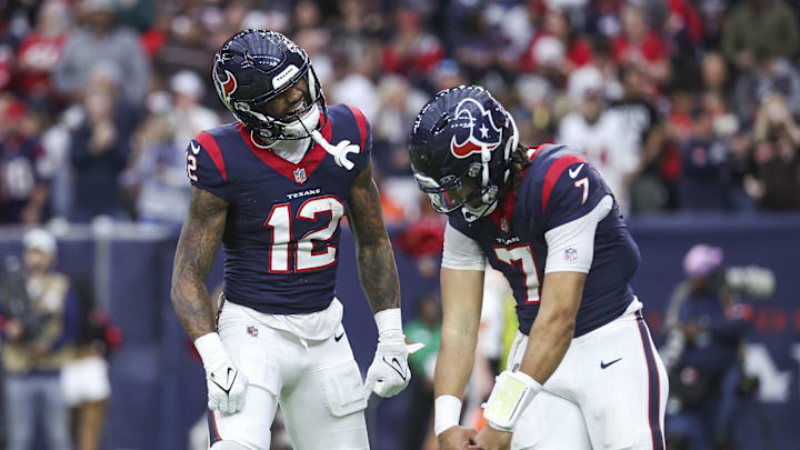 Jan 13, 2024; Houston, Texas, USA; Houston Texans wide receiver Nico Collins (12) celebrates with quarterback C.J. Stroud (7) after a touchdown in a 2024 AFC wild card game against the Cleveland Browns at NRG Stadium. Mandatory Credit: Troy Taormina-Imagn Images