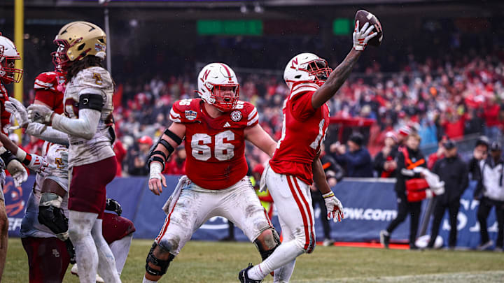 Dec 28, 2024; Bronx, NY, USA; Nebraska Cornhuskers running back Rahmir Johnson (14) celebrates after scoring a rushing touchdown during the first half against the Boston College Eagles at Yankee Stadium. Dec 28, 2024; Bronx, NY, USA; Nebraska Cornhuskers running back Rahmir Johnson (14) celebrates after scoring a rushing touchdown during the first half against the Boston College Eagles at Yankee Stadium.