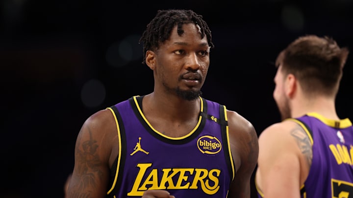 Mar 31, 2025; Los Angeles, California, USA;  Los Angeles Lakers forward Dorian Finney-Smith (17) reacts to a play during the fourth quarter against the Houston Rockets at Crypto.com Arena. Mandatory Credit: Kiyoshi Mio-Imagn Images