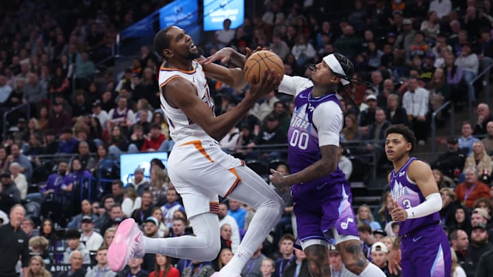 Dec 13, 2024; Salt Lake City, Utah, USA; Phoenix Suns forward Kevin Durant (35) is fouled going to the basket by Utah Jazz guard Jordan Clarkson (00) during the fourth quarter at Delta Center. Mandatory Credit: Rob Gray-Imagn Images Dec 13, 2024; Salt Lake City, Utah, USA; Phoenix Suns forward Kevin Durant (35) is fouled going to the basket by Utah Jazz guard Jordan Clarkson (00) during the fourth quarter at Delta Center. Mandatory Credit: Rob Gray-Imagn Images