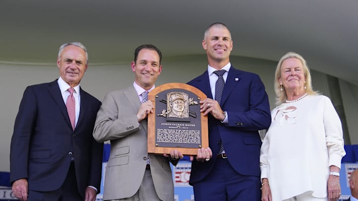 Baseball Commissioner Rob Manfred and Hall of Fame President Josh Rawitch and National Baseball Hall of Fame chairman of the board Jane Forbes Clark pose with Hall of Fame Inductee Joe Mauer with his Baseball Hall of Fame plaque during the National Baseball Hall of Fame Induction Ceremony in Cooperstown, N.Y., on July 21, 2024. Baseball Commissioner Rob Manfred and Hall of Fame President Josh Rawitch and National Baseball Hall of Fame chairman of the board Jane Forbes Clark pose with Hall of Fame Inductee Joe Mauer with his Baseball Hall of Fame plaque during the National Baseball Hall of Fame Induction Ceremony in Cooperstown, N.Y., on July 21, 2024.