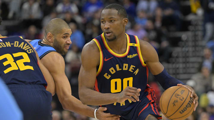 Dec 27, 2024; Inglewood, California, USA; Golden State Warriors forward Jonathan Kuminga (00) drives around Los Angeles Clippers forward Nicolas Batum (33) in the second half at Intuit Dome. Mandatory Credit: Jayne Kamin-Oncea-Imagn Images