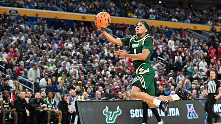 Mar 19, 2026; Buffalo, NY, USA; South Florida Bulls guard Gavin Hightower (9) shoots a lay up during the second half against the Louisville Cardinals during a first round game of the men's 2026 NCAA Tournament at Keybank Center. Mandatory Credit: Mark Konezny-Imagn Images