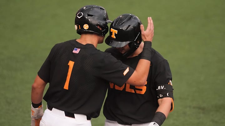 Tennessee's Dean Curley (1) and Levi Clark (30) celebrate Clark's 2-run home during at the NCAA college baseball Knoxville Regional final against Wake Forest on June 1, 2025, in Knoxville, Tenn.