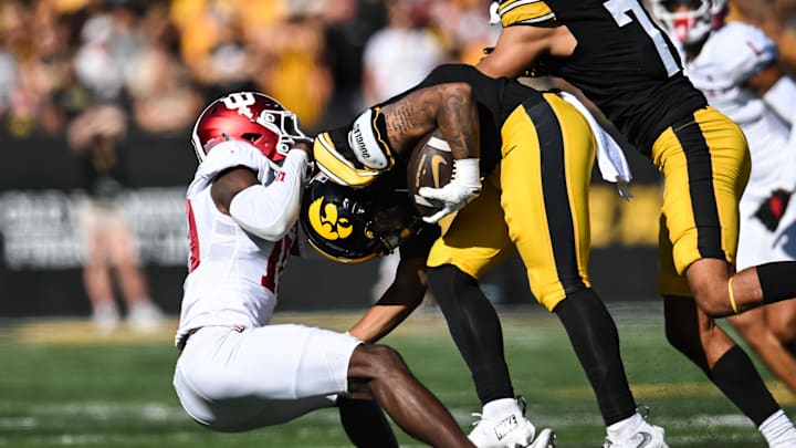 Sep 27, 2025; Iowa City, Iowa, USA; Iowa Hawkeyes running back Kamari Moulton (28) is tackled by Indiana Hoosiers defensive back Ryland Gandy (10) during the second quarter at Kinnick Stadium. Mandatory Credit: Jeffrey Becker-Imagn Images