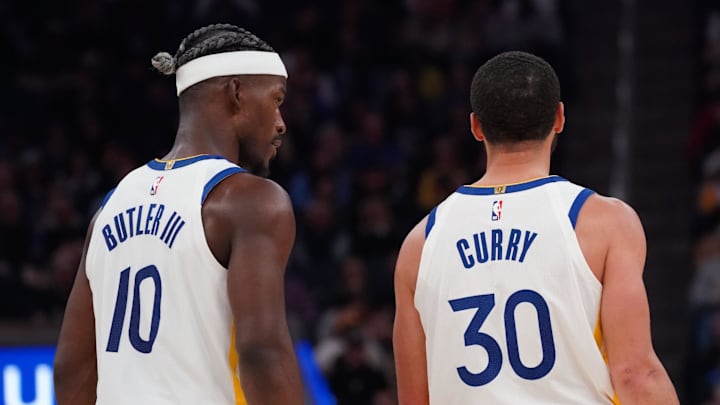 Mar 8, 2025; San Francisco, California, USA; Golden State Warriors forward Jimmy Butler III (10) talks with guard Stephen Curry (30) during a game against the Detroit Pistons in the second quarter at Chase Center. Mandatory Credit: David Gonzales-Imagn Images